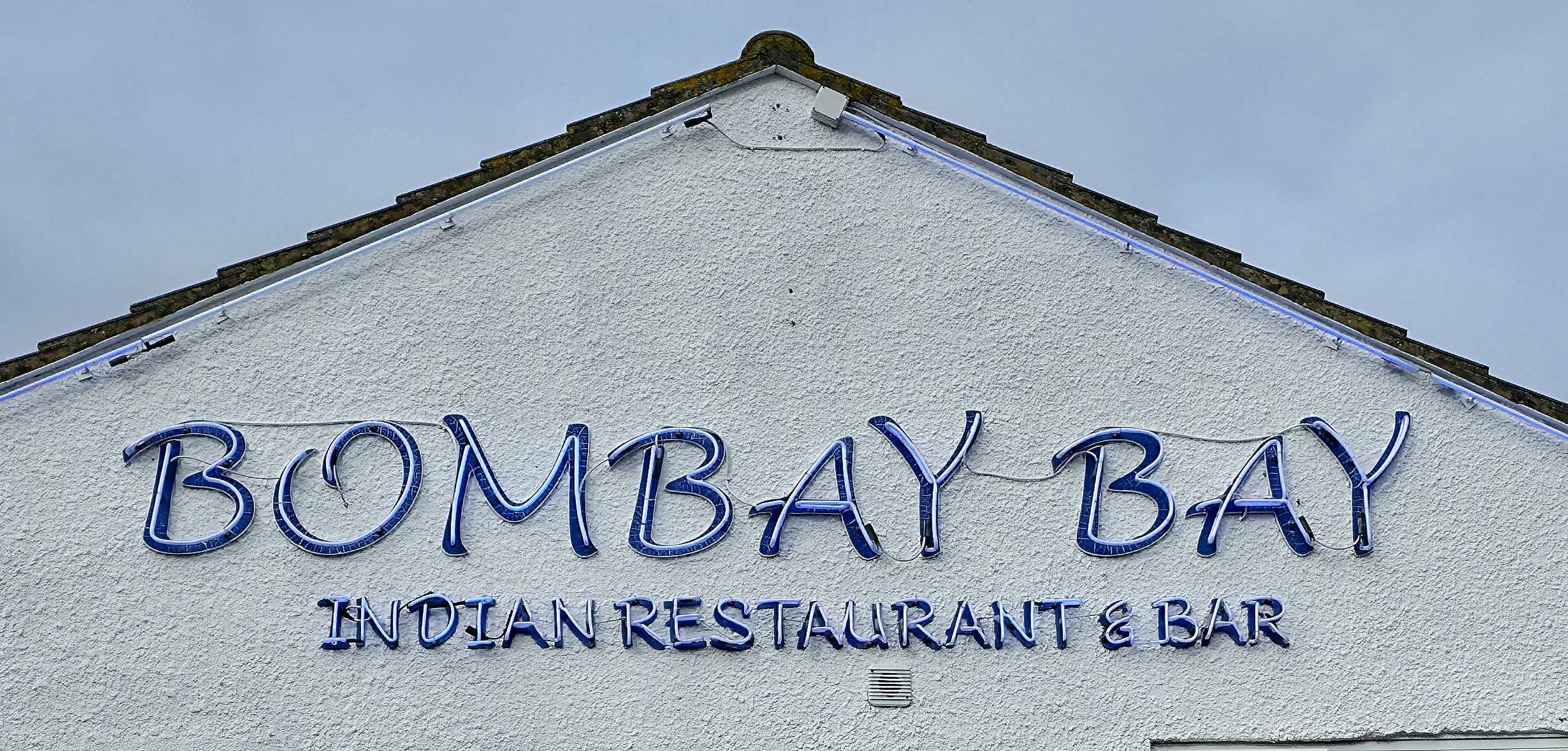 Bombay Bay, Southsea, Hampshire, United Kingdom, Indian Cuisine wall sign advertisement.