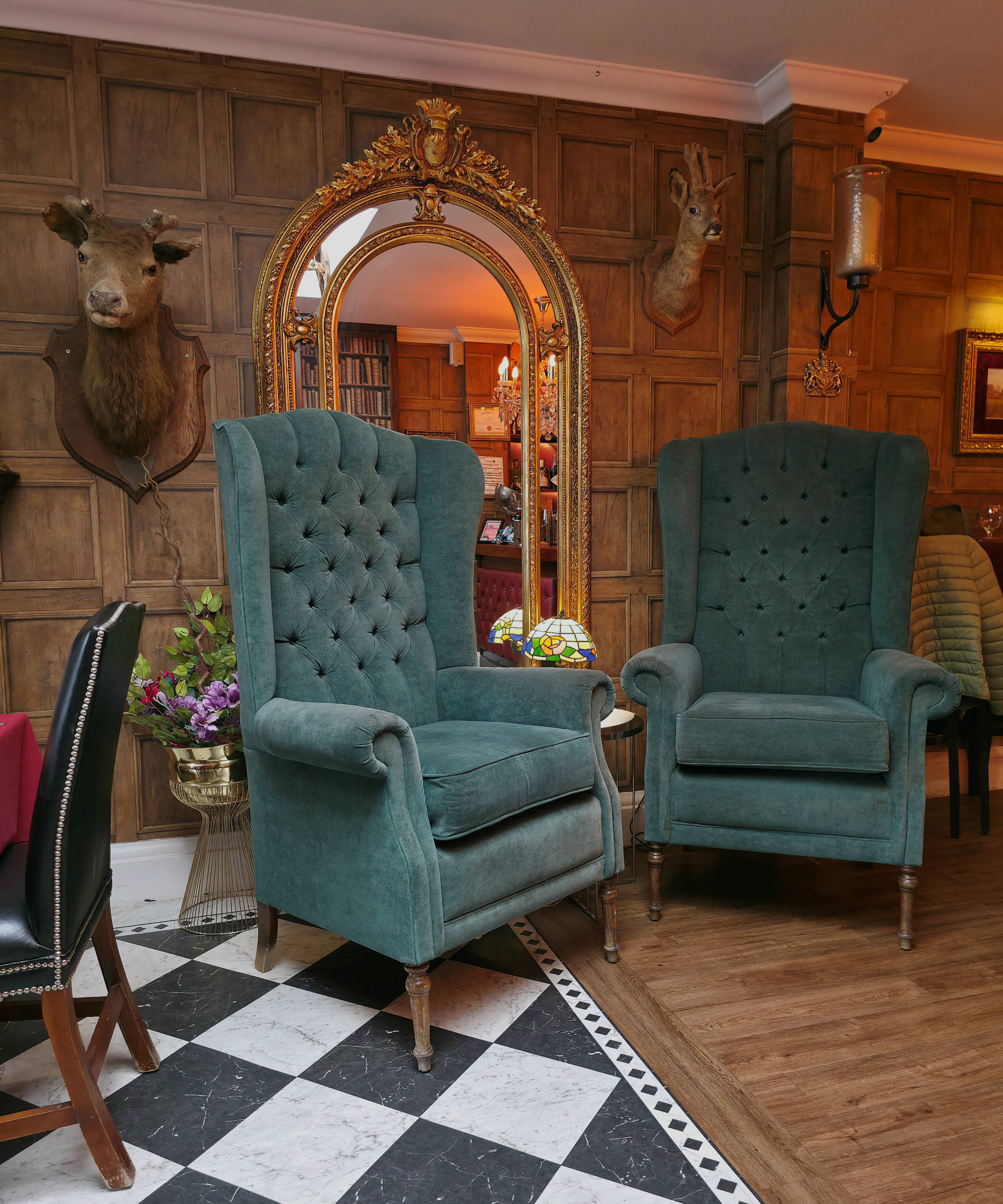 A photo taken of the sea blue, green chairs inside Chambers, Southsea in November 2025, by Baldi, A.K.A Amonn AL-Mahrouq